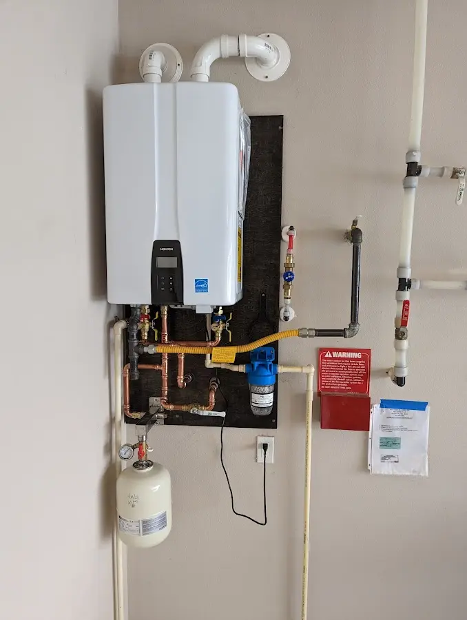 Professional plumber installing copper piping in a Edmonds home